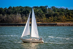 Sailboat Passes Long Island Head Light in Massachusetts